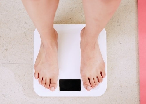 woman standing on scales