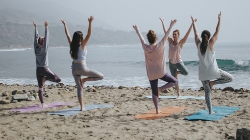 yoga class on a beach