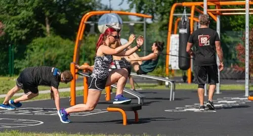 people exercising in outdoor gym